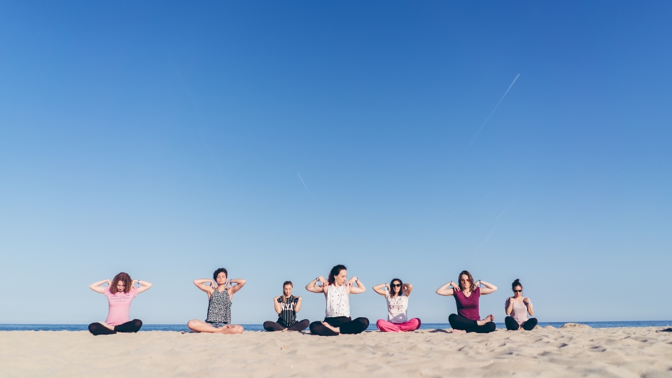 People gathering at a yoga community event.