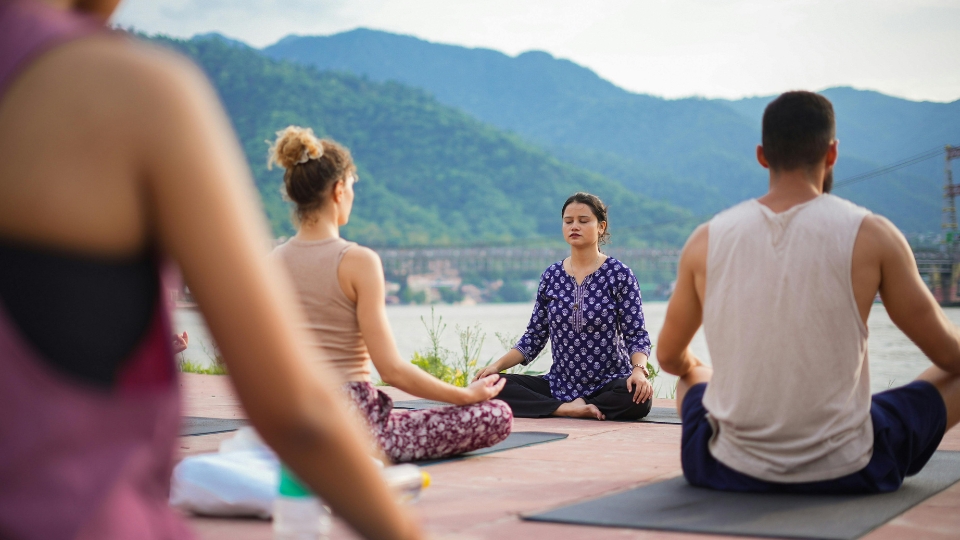 A teacher leading an asana class.